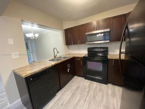 101-6a-446 Ne 210th Circle Ter, Miami, FL, 33179-1899 | Card Image