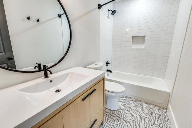 Full bathroom featuring shower / bathing tub combination, vanity, and toilet | Image 22