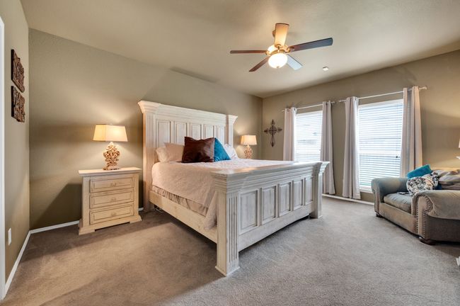 Bedroom with carpet floors and a ceiling fan | Image 18