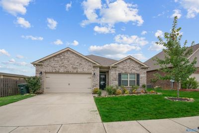 New paint, new light fixtures, new painted kitchen island, new kitchen faucet, granite counter tops, kitchen backsplash and plenty of space to cook and entertain | Image 1