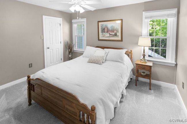 Carpeted bedroom featuring baseboards and ceiling fan | Image 34