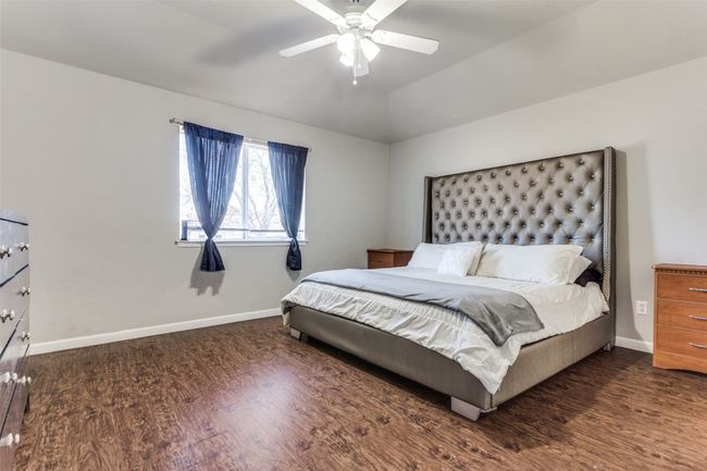 Primary Bedroom featuring vaulted ceiling, ceiling fan, and dark wood-type flooring | Image 9