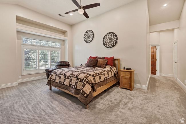 Bedroom featuring light colored carpet, recessed lighting, and ceiling fan | Image 32
