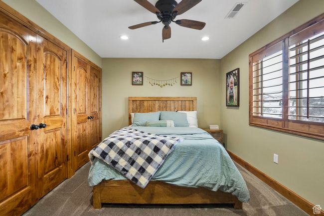 Bedroom with baseboards, visible vents, recessed lighting, and a ceiling fan | Image 22