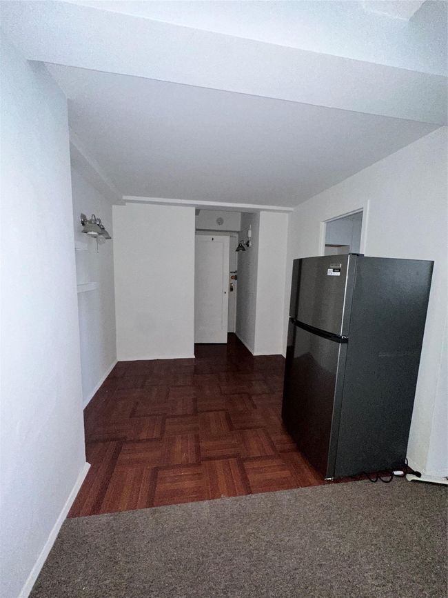 Kitchen with baseboards and refrigerator | Image 12
