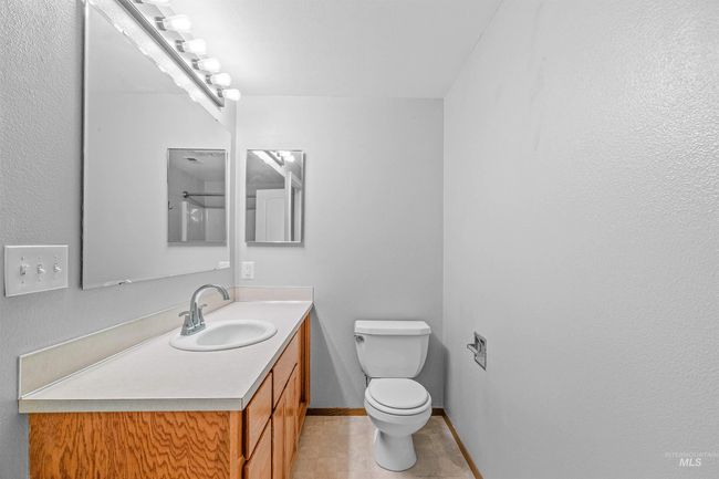 Half bathroom with vanity and tile patterned flooring | Image 27