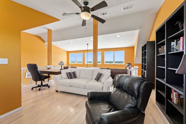 Living area with ceiling fan, visible vents, recessed lighting, and light wood-type flooring | Image 19