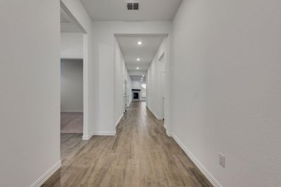 Corridor with light hardwood / wood-style floors | Image 3