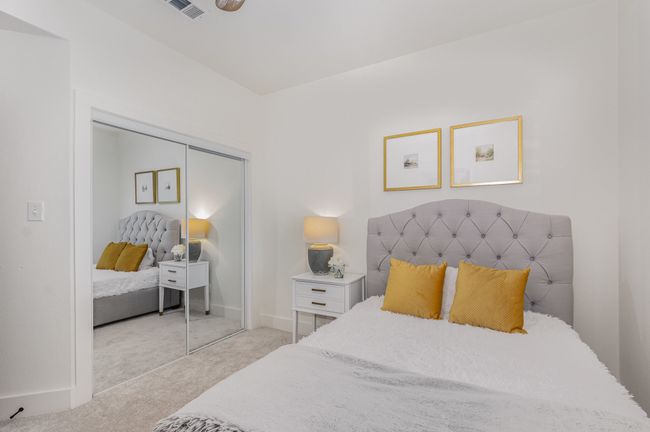 Carpeted bedroom with a closet | Image 25