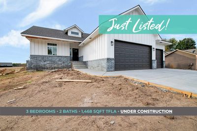 View of front of house featuring a garage | Image 1