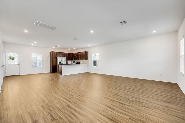 Unfurnished living room featuring recessed lighting, plenty of natural light, and light wood finished floors | Image 8