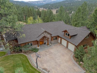 View of front facade with a front yard and a mountain view | Image 1