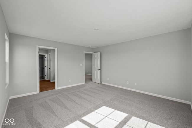 unfurnished bedroom featuring baseboards and carpet | Image 24