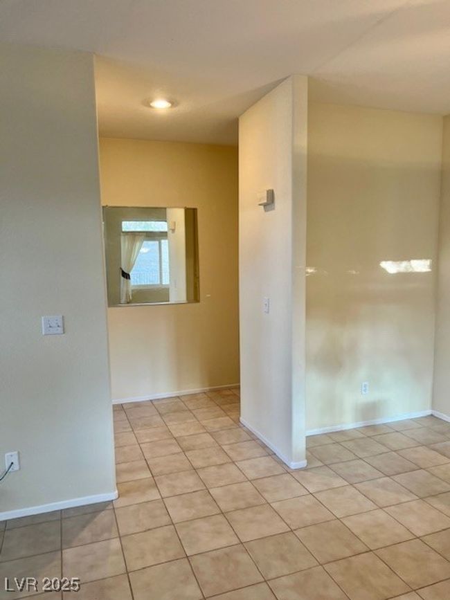 Washroom featuring visible vents, hookup for a washing machine, a textured ceiling, cabinet space, and light tile patterned floors | Image 27