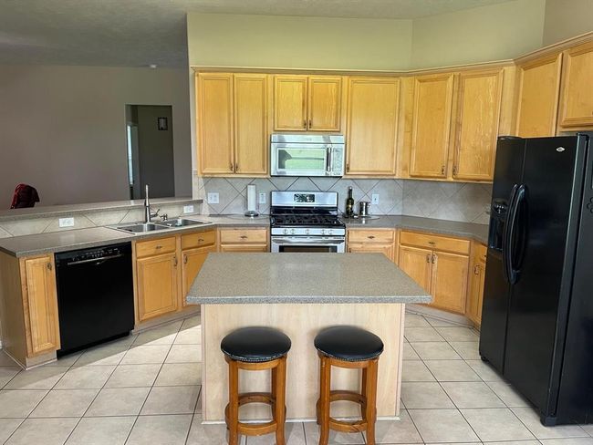 Open Island Kitchen with Breakfast Bar. Refrigerator Included! | Image 4