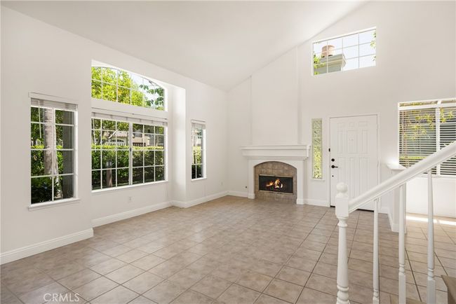 Spacious living area with fireplace | Image 9