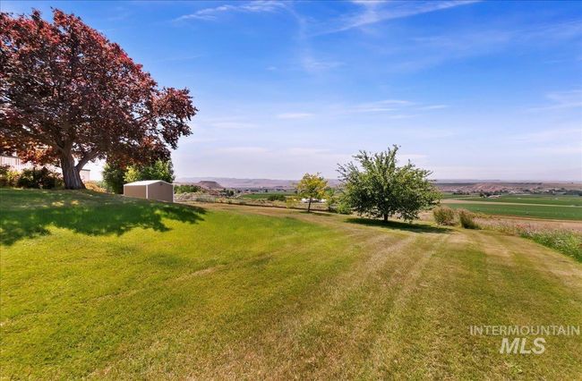 View of grassy yard with an outbuilding and a view of rural / pastoral area | Image 41