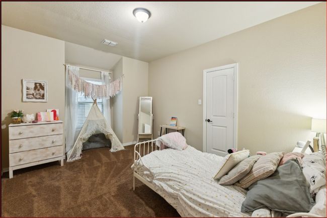 Bedroom featuring carpet | Image 22