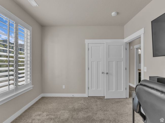 Carpeted office space with baseboards | Image 11