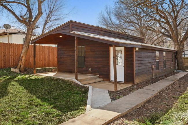 View of outdoor structure with an outbuilding and fence | Image 31