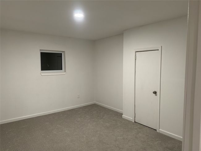 Carpeted spare room featuring baseboards | Image 26