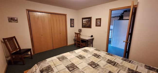 Main level bedroom featuring carpet floors and a closet | Image 37