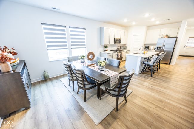 dining space with light wood-style floors, recessed lighting, and baseboards | Image 10