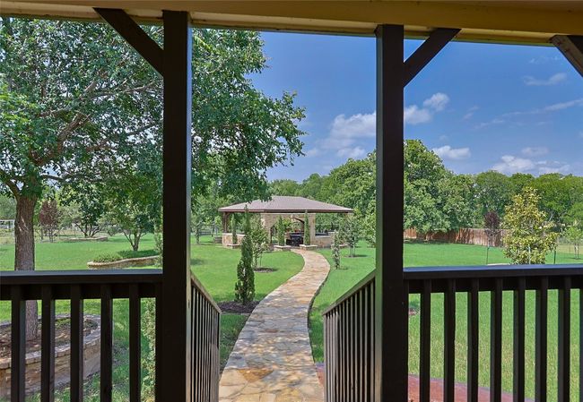 View of yard featuring a gazebo and fence | Image 20