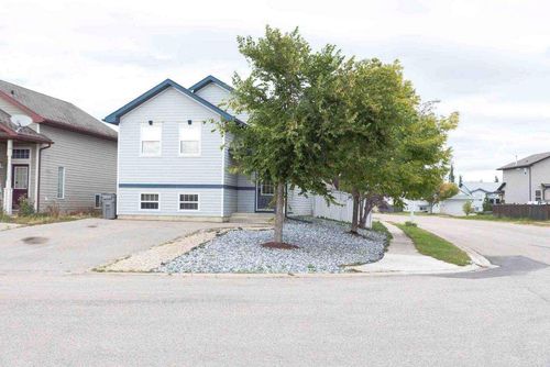 8838 65 Avenue, Home with 4 bedrooms, 2 bathrooms and 4 parking in Grande Prairie AB | Card Image