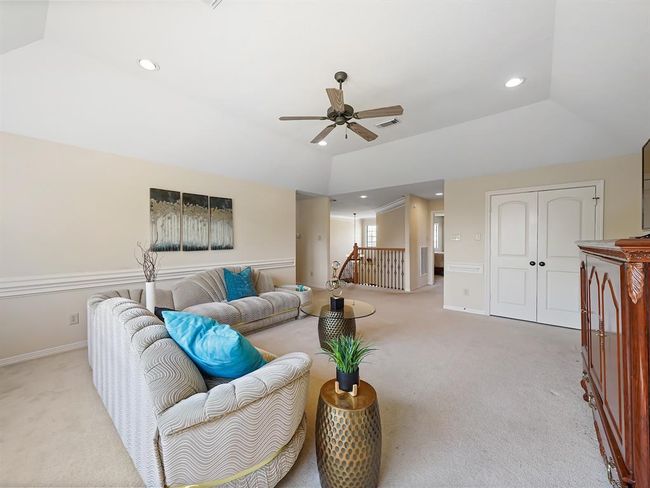 Expansive upstairs game room perfect for entertainment and relaxation. | Image 36