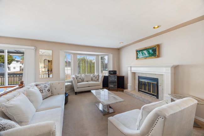 Carpeted living area with recessed lighting, a premium fireplace, and plenty of natural light | Image 9