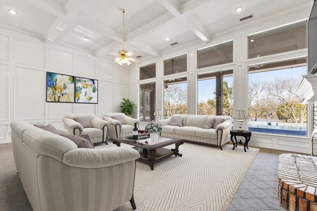 Great Room with that GORGEOUS view of the pool AND the golden pond. Virtually staged | Image 16