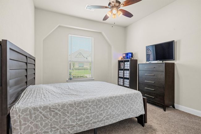 Bedroom with light carpet and ceiling fan | Image 14