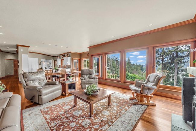 Living room with crown molding, recessed lighting, and light wood-style floors | Image 21