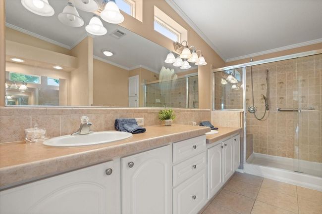 Double Vanities in Master Suite, Walk-In Shower with Handicap Rail and Seat, Adjustable Shower Head | Image 13