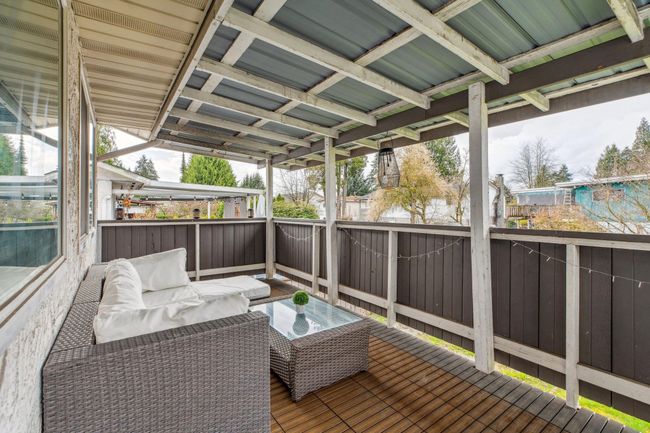 Wooden terrace featuring an outdoor living space | Image 31
