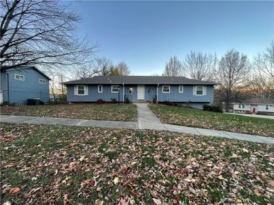 Ranch-style home with a front lawn | Image 1