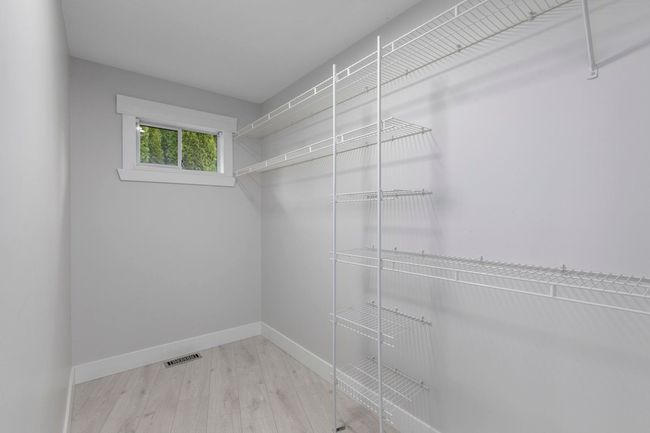 Walk in closet featuring visible vents | Image 23