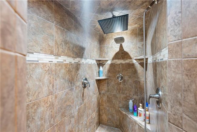 Interior details featuring tiled shower | Image 31