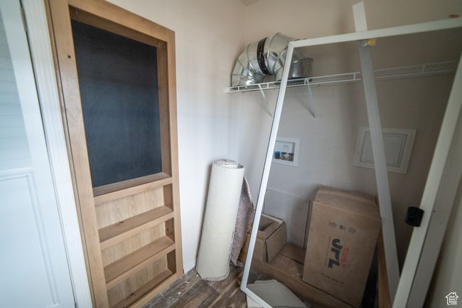 Clothes washing area with washer hookup, wood finished floors, and laundry area | Image 55
