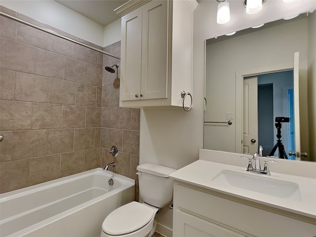 Full bathroom with toilet, shower combination, and vanity | Image 11