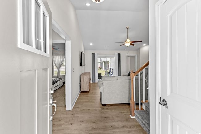 Foyer entrance with ceiling fan, stairs, light wood-type flooring, recessed lighting, and baseboards | Image 17
