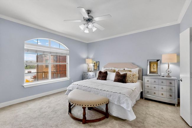 Carpeted bedroom with ornamental molding and a ceiling fan | Image 20