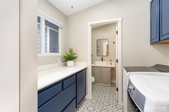 Main floor laundry room with full bathroom | Image 27