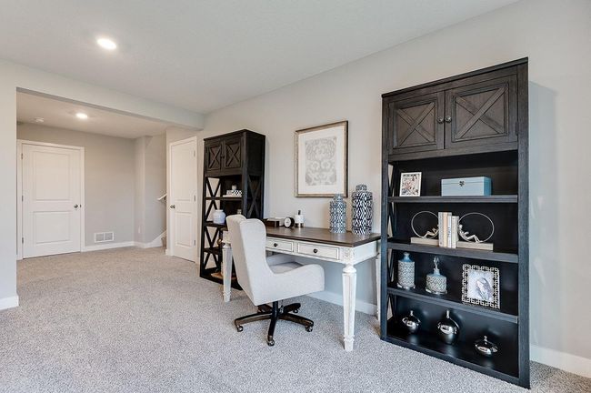 All of that living space up - plus this INCLUDED FINISHED lower level which features an over-sized bedroom with a walk-in closet, another full bathroom plus a giant family room! Photo of model, colors and options will vary. | Image 20