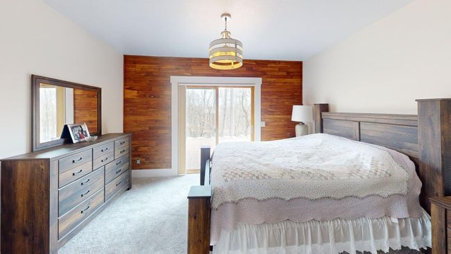 Primary suite w/patio doors, huge walk-in closet & private BA | Image 11
