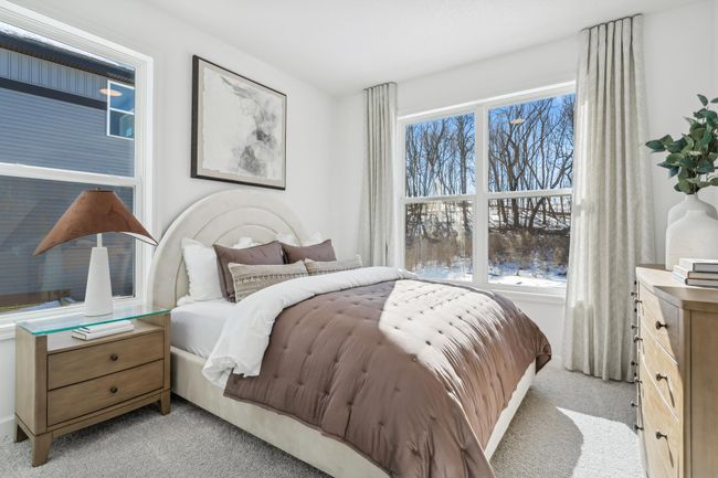 Photo is of the actual model. The main level bedroom. | Image 15