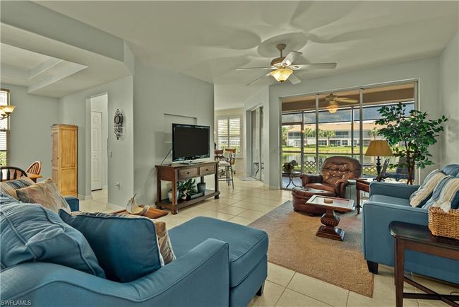 Tiled living room featuring ceiling fan | Image 4