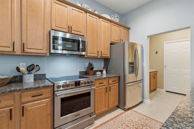 Equipped with high-quality stainless steel appliances, perfect for everyday cooking or entertaining. | Image 10