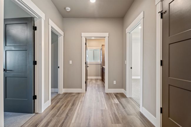 Hall featuring light wood-style flooring and baseboards | Image 30